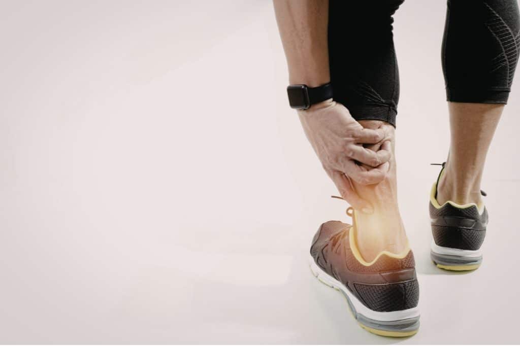 A runner suffers from heel pain while out jogging