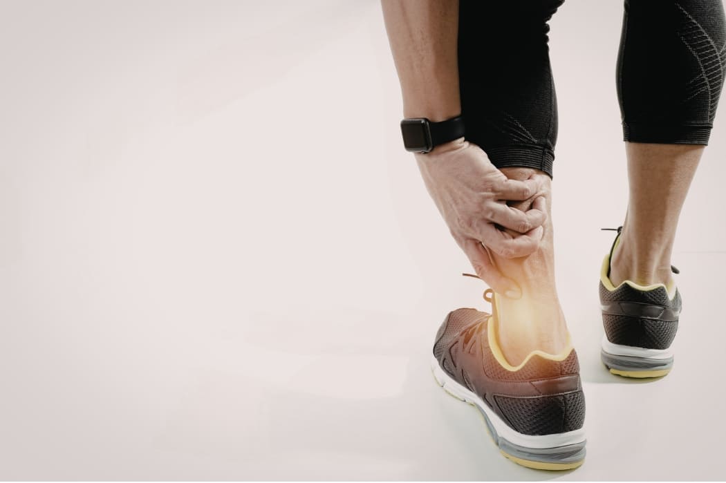 A runner suffers from heel pain while out jogging